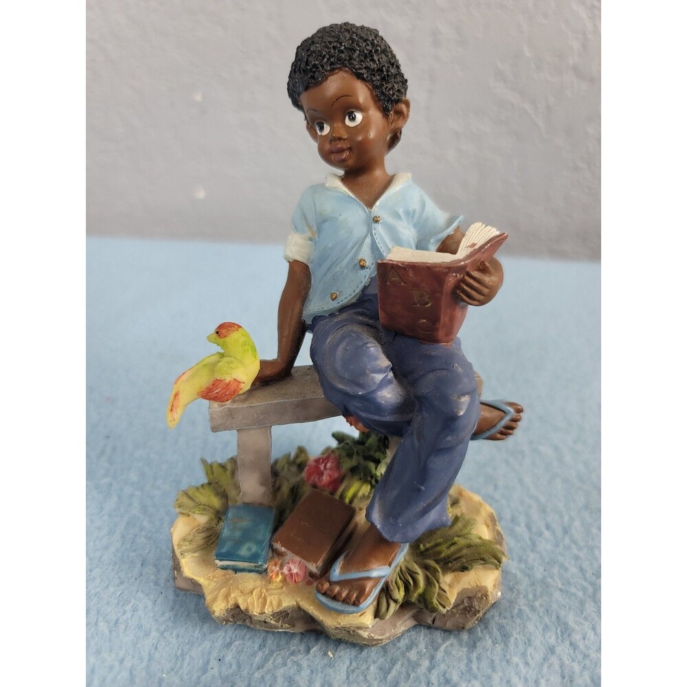 Lareaux of miami Figurine Kid Sitting On Bench Reading Books Yellow Bird